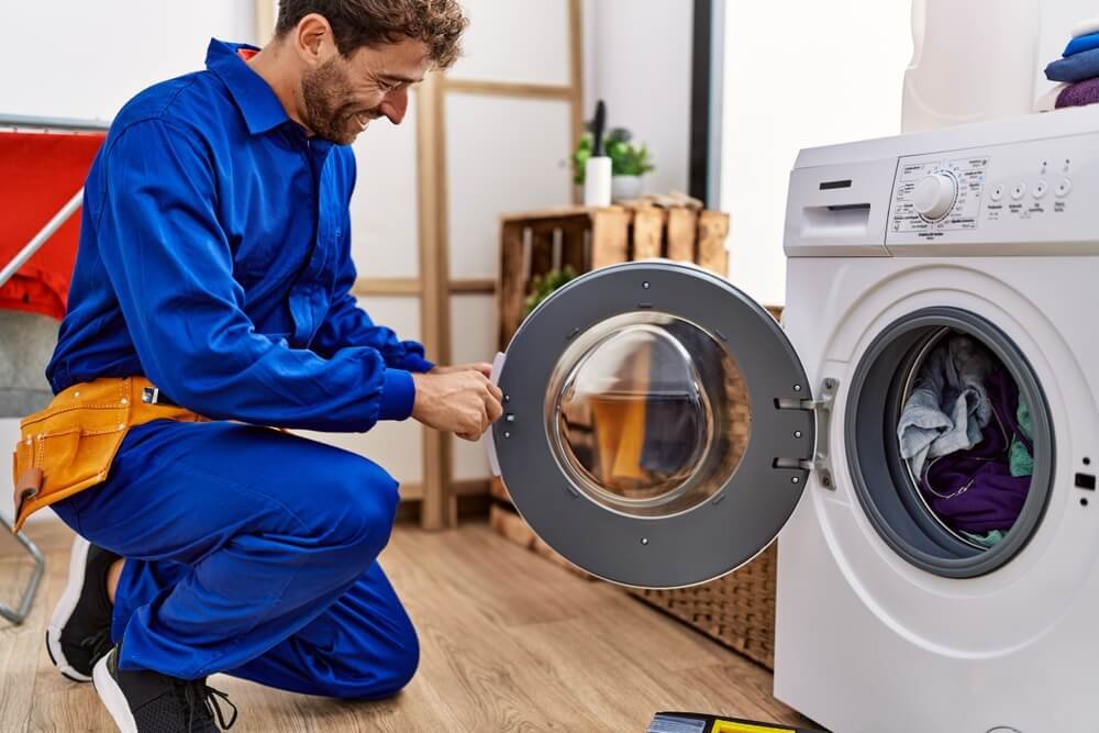 Happy man repair Washing Machin